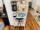 Convenient kitchenette shelving featuring coffee maker, cups, and utensils for easy beverage and snack preparation at 6001 - 1599 S Kings Hwy., Myrtle Beach, SC 29575
