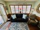 A cozy living room features a comfortable sofa, recliner, and bright windows at 6001 - 1599 S Kings Hwy., Myrtle Beach, SC 29575