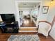 Cozy living room view with fireplace and peek into dining area with seating at 6001 - 1599 S Kings Hwy., Myrtle Beach, SC 29575