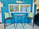 Outdoor patio table and chairs on the home's porch at 6001 - 1599 S Kings Hwy., Myrtle Beach, SC 29575