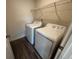 Convenient laundry room with washer, dryer, and wire shelving at 623 Muster Field Ct., Conway, SC 29526