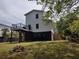 Exterior back of house featuring a deck, and grassy yard with mature trees at 69 Sea Level Loop, Pawleys Island, SC 29585