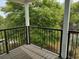 View from the balcony overlooking mature trees and well maintained grounds at 69 Sea Level Loop, Pawleys Island, SC 29585