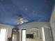 Unique bedroom ceiling painted like a starry night sky with a ceiling fan at 69 Sea Level Loop, Pawleys Island, SC 29585