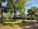 Inviting elevated coastal home featuring a spacious front porch and lush green landscaping at 69 Sea Level Loop, Pawleys Island, SC 29585