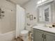 Bathroom featuring a shower, a vanity with storage, and a stylish mirror for a functional and inviting space at 834 Holly Sands Blvd., Little River, SC 29566