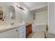 Bathroom showcasing a bathtub, a vanity, and decorative wall shelves for a clean and stylish look at 834 Holly Sands Blvd., Little River, SC 29566