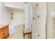 Bathroom featuring a jacuzzi tub, a walk-in shower, tile flooring, and a decorative wooden cabinet at 834 Holly Sands Blvd., Little River, SC 29566