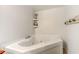 Close-up of a bathtub showcasing its clean design and highlighting the surrounding tilework at 834 Holly Sands Blvd., Little River, SC 29566