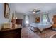 Spacious bedroom with a wooden bed, matching dressers, and a colorful rug for a luxurious feel at 834 Holly Sands Blvd., Little River, SC 29566