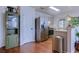 Modern kitchen featuring stainless steel appliances, light gray cabinetry, and sleek countertops with hardwood floors at 834 Holly Sands Blvd., Little River, SC 29566