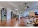 Open-concept living room featuring hardwood floors, recessed lighting, and a seamless transition to the kitchen area at 834 Holly Sands Blvd., Little River, SC 29566