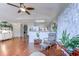 Spacious living area featuring hardwood floors, a vaulted ceiling, and seamless flow to the kitchen and dining areas at 834 Holly Sands Blvd., Little River, SC 29566