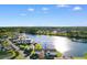 Lovely aerial view of condos by a lake in a quiet community with mature landscaping at 8835 Chandler Dr. # E, Myrtle Beach, SC 29575