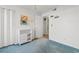 Bright bedroom featuring a closet, a door to the bathroom and basic furniture at 8835 Chandler Dr. # E, Myrtle Beach, SC 29575