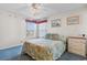 Serene bedroom featuring a plush bed, bright windows, and charming coastal-themed decor at 8835 Chandler Dr. # E, Myrtle Beach, SC 29575