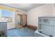 Bedroom featuring bright window, blue carpet, curio cabinet, and decorations at 8835 Chandler Dr. # E, Myrtle Beach, SC 29575