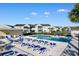 A view of the community pool with ample lounge chairs and several townhomes at 8835 Chandler Dr. # E, Myrtle Beach, SC 29575