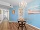 Light and bright dining area featuring a decorative table and a beautiful chandelier at 8835 Chandler Dr. # E, Myrtle Beach, SC 29575