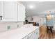 Open-concept dining and kitchen area featuring a chandelier and beach-themed decor at 8835 Chandler Dr. # E, Myrtle Beach, SC 29575
