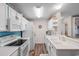 Well-equipped kitchen featuring white appliances, ample counter space, and overhead lighting at 8835 Chandler Dr. # E, Myrtle Beach, SC 29575