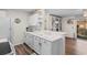 Spacious kitchen with white countertops, dual sink, and a breakfast bar looking into the living room at 8835 Chandler Dr. # E, Myrtle Beach, SC 29575