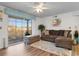 Cozy living room with sliding glass doors and balcony access, a plush sectional sofa, and stylish decor at 8835 Chandler Dr. # E, Myrtle Beach, SC 29575