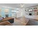 Open-concept living area flowing into a kitchen with white cabinetry and modern appliances at 8835 Chandler Dr. # E, Myrtle Beach, SC 29575