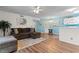 Bright living room with a plush sectional, adjacent to the dining area and with beach-themed decor at 8835 Chandler Dr. # E, Myrtle Beach, SC 29575