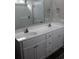 Bathroom featuring double sink vanity, white cabinetry and shower with glass door at Tbd5 Persimmon Rd., Aynor, SC 29511