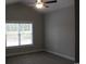 Comfortable bedroom with plush carpet, large window, and ceiling fan at Tbd5 Persimmon Rd., Aynor, SC 29511