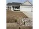 Charming single-story home featuring a two-car garage and a well-manicured lawn at Tbd5 Persimmon Rd., Aynor, SC 29511