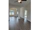 Bright and airy living room with hardwood floors, recessed lighting, and arched doorways at Tbd5 Persimmon Rd., Aynor, SC 29511