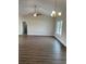 Spacious living room featuring hardwood floors, vaulted ceiling, and ample natural light at Tbd5 Persimmon Rd., Aynor, SC 29511