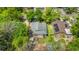 A cozy home with a backyard deck, perfect for relaxation, complemented by a lush green lawn and mature trees providing ample shade at 1021 Myrtle Dr., Surfside Beach, SC 29575