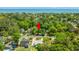 A charming home nestled in a verdant neighborhood near the ocean, surrounded by mature trees and offering a tranquil setting at 1021 Myrtle Dr., Surfside Beach, SC 29575