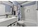 A bright bathroom featuring updated vanity with modern fixtures and tile surround bathtub at 1021 Myrtle Dr., Surfside Beach, SC 29575