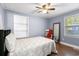 A bedroom featuring wood-look flooring, a ceiling fan, and natural light at 1021 Myrtle Dr., Surfside Beach, SC 29575