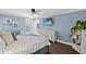 This bedroom features a ceiling fan, television, and access to an outdoor patio at 1021 Myrtle Dr., Surfside Beach, SC 29575