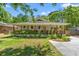 Charming home featuring a welcoming front porch with lovely plants and a well-maintained lawn at 1021 Myrtle Dr., Surfside Beach, SC 29575