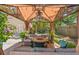 Covered gazebo with comfortable seating, a fire pit, and ambient lighting creating an inviting outdoor gathering spot at 1021 Myrtle Dr., Surfside Beach, SC 29575