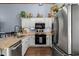 Bright kitchen with stainless steel appliances and granite countertops at 1021 Myrtle Dr., Surfside Beach, SC 29575