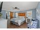 Serene main bedroom featuring a barn door to the bathroom and hardwood floors at 1021 Myrtle Dr., Surfside Beach, SC 29575