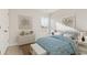 Serene bedroom with nautical decor, light-colored wood furnishings, and a picturesque window view at 215 Warner Crossing Way, Loris, SC 29569