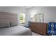 Comfortable bedroom with a patterned headboard, ample natural light, and stylish decor at 215 Warner Crossing Way, Loris, SC 29569