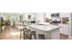 Open concept kitchen with granite countertops, stainless steel appliances, and a breakfast bar with seating at 215 Warner Crossing Way, Loris, SC 29569