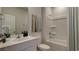 Bright bathroom features a vanity with countertop, a stylish mirror, and a shower-tub combination at 216 Warner Crossing Way, Loris, SC 29569