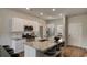 Modern kitchen featuring granite countertops, stainless steel appliances, and a central island with seating at 216 Warner Crossing Way, Loris, SC 29569