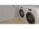 Well-equipped laundry room with a modern washer and dryer, providing convenience and efficiency at 216 Warner Crossing Way, Loris, SC 29569