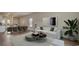 Comfortable living room showcasing a sofa, coffee table, and a view into the modern kitchen at 216 Warner Crossing Way, Loris, SC 29569